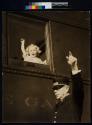 [girl in train mimicking conductor]