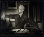 [Employer's Group, scarecrow behind desk]