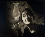 [Corning Glass, woman with old fashioned lamp]