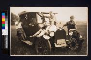 [Katherine Rich (side of car), Sally Tompkins, George Coxhead and Harriet Rich (interior of car), Billy Owens, Barr Rich, and George Rich (all on front of car).  


]