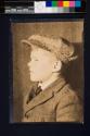 [George Rich in tweed jacket and cap]