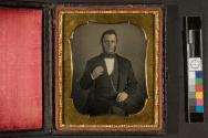 [Man holding daguerreotype in case]