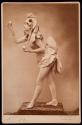 [Dancer in costume holding eggs]