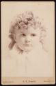 [Young child with ringlets]