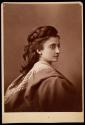 [Woman with wavy hair in elaborate drapery]