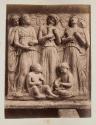 [Sculpted panel (band of singing angels?)]