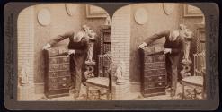 "Building up" on Underwood Patent Extension Stereograph Cabinet, - in a home Library