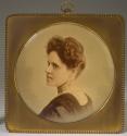 [Woman in lace collar and pearl earrings]