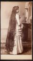 [Flora Dix Proctor, standing with long, loosed hair to the ground]