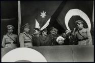 King Abdallah [sic] of Transjordania with the Turkish general staff watching the military display.