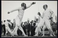 [Olympic champion fencers, including Aladar Gerevitch, demonstrate their skill at the nationalized Manfred Ganz Machine Works]