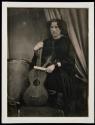 [Woman with guitar]