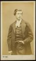 [Young man standing with hand in pocket]