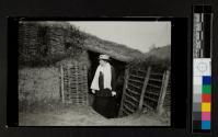 [Woman emerging from an old trench on the Marne battlefield - taken June 1916]