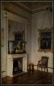 [Interior of a room with fireplace and reproduction of Raffael, "Madonna with Goldfinch"]