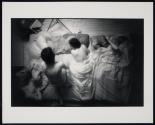 [People laying down on mattresses]
