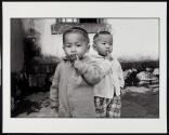 Young Boy with Mickey Mouse Ears, Lutu Village, Yunnan Province, China