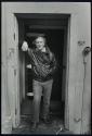[Man in doorway]