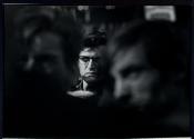 [Man's face in crowd]