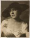 [Woman in large hat]