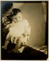 [Woman holding a baby]