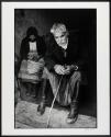 Blind man in doorway of his house, Crete, Greece