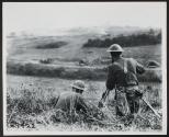Lt. McDonald making movies of Sixth Field Artillery, First Division, while they are being shelled from their position. Near Exermont, Ardennes, France.