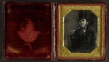 [Man in top hat with cigarette]