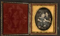 [Two little girls in Victorian chair]