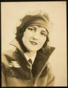[Model (Ruth Malcomson) in high collar and beret]