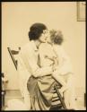 [Woman (model Ruth Malcomson) kissing a toddler]