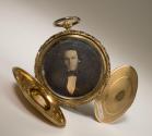 [Watch locket with daguerreotype of man and ambrotype of woman]