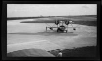 [Small Pan Am plane on airfield]