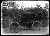 [Dr. Ernst Wilkens in an electric car]