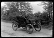 [Dr. Ernst Wilkens in an electric car]