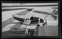 [Small Pan-Am plane on airfield]