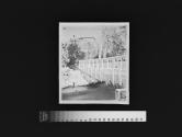 [Frozen bridge in forest]