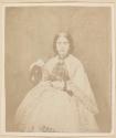 [Young woman, seated]