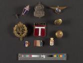 [Small collection of Lt. Freeman's military pins and uniform buttons, (English, Scottish, French) probably received in trade for American equivalents]