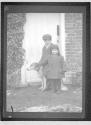 [son, daughter of E.O. Hoppé with dog at Little Hedgecourt]