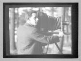 [Clarence H. White with bellows camera]