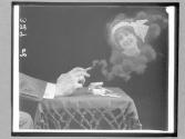[Woman's Face In Cigarette Smoke]