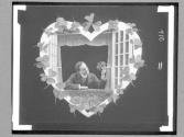 [Man Holding Flowers In Heart]