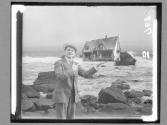 [Man Holding House]