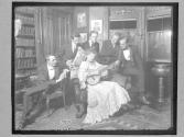 [Men Grouped Around Woman Guitar Player]