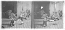 [Children by woodstove]
