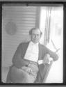 [William Jennings Bryant seated on porch]
