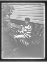 [Boy on bench]