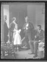 [William Jennings Bryant and family standing on porch]