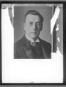[Man with monocle]